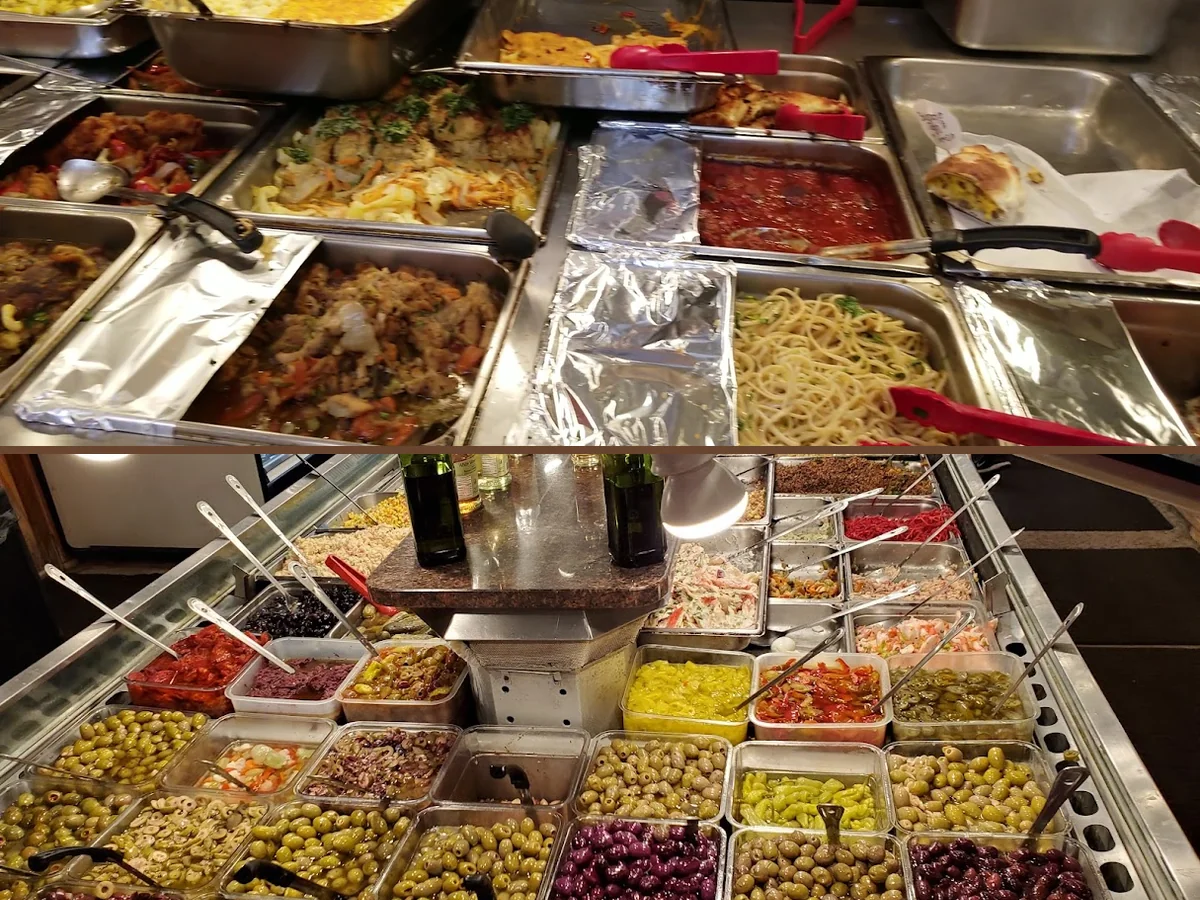 Counter-service buffet with Chinese dishes behind glass.
