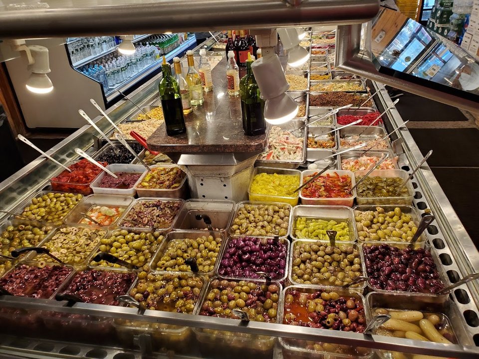 Counter-service buffet with Chinese dishes behind glass.