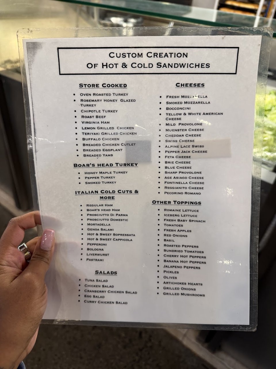 Printed menu with buffet items and meal deals.