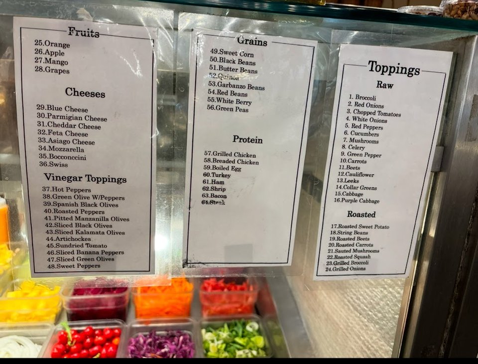 Menu layout showing salads, cheeses, and toppings.