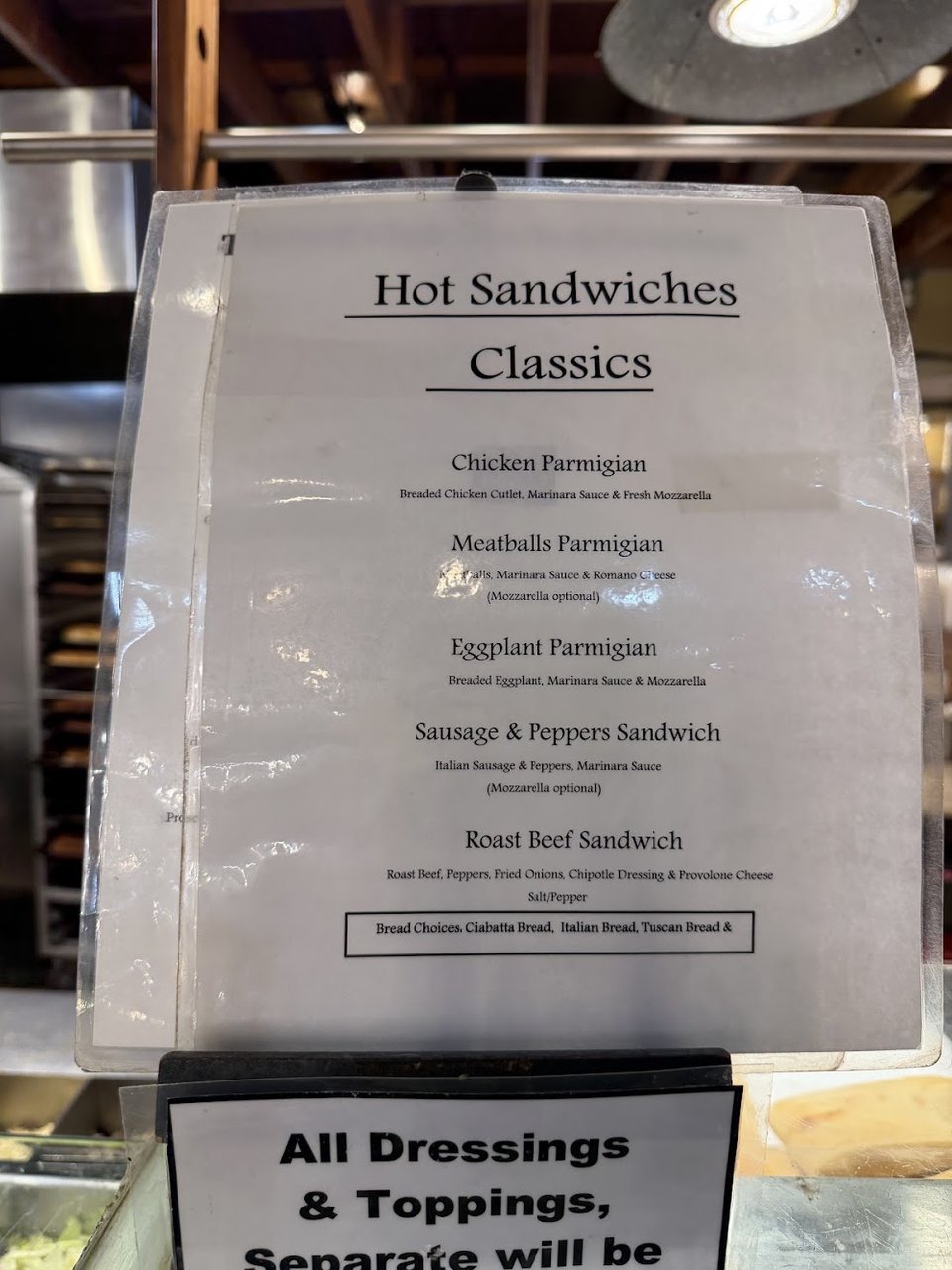 Restaurant menu featuring turkey, ham, and chicken salad.